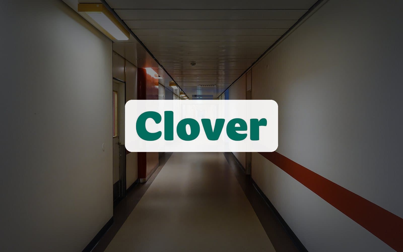 Clover Health logo over a hospital corridor