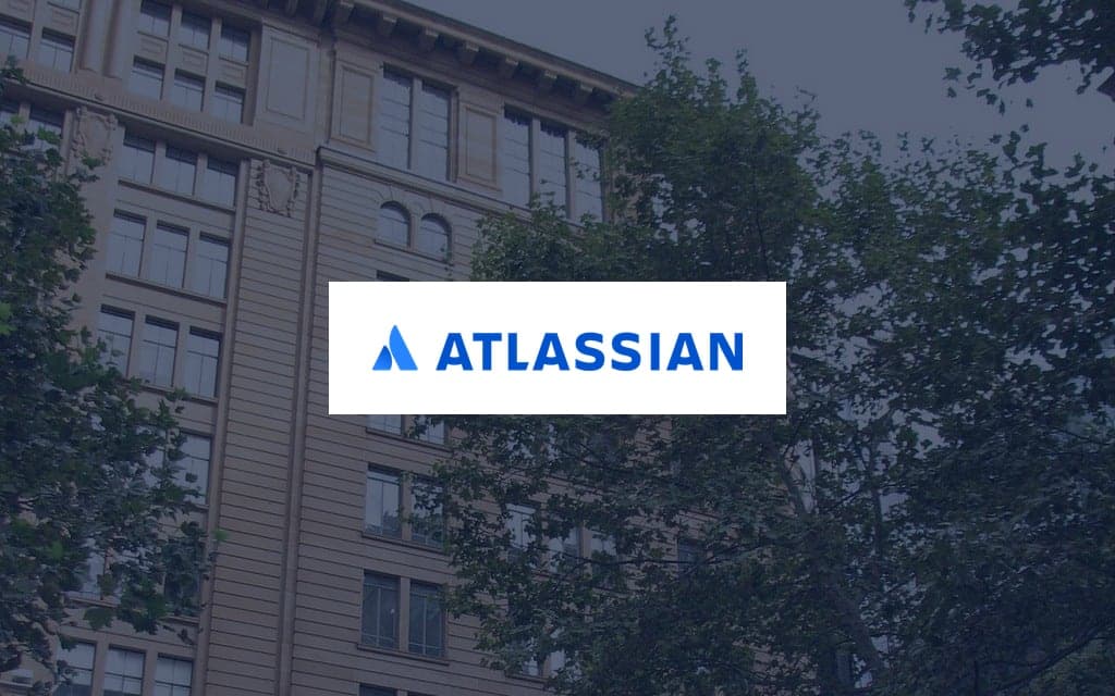 Atlassian logo over a photo of the company