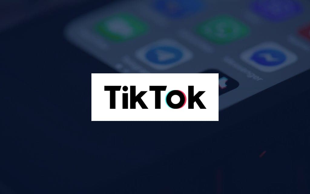 TikTok logo over a photo of the company