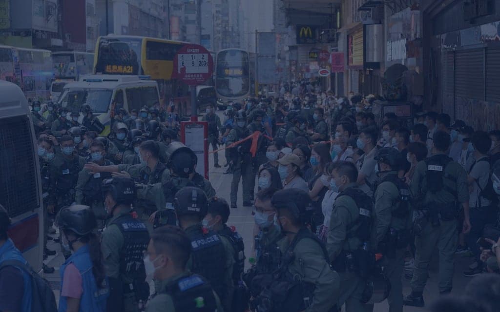 Police making an arrest in a neutral setting