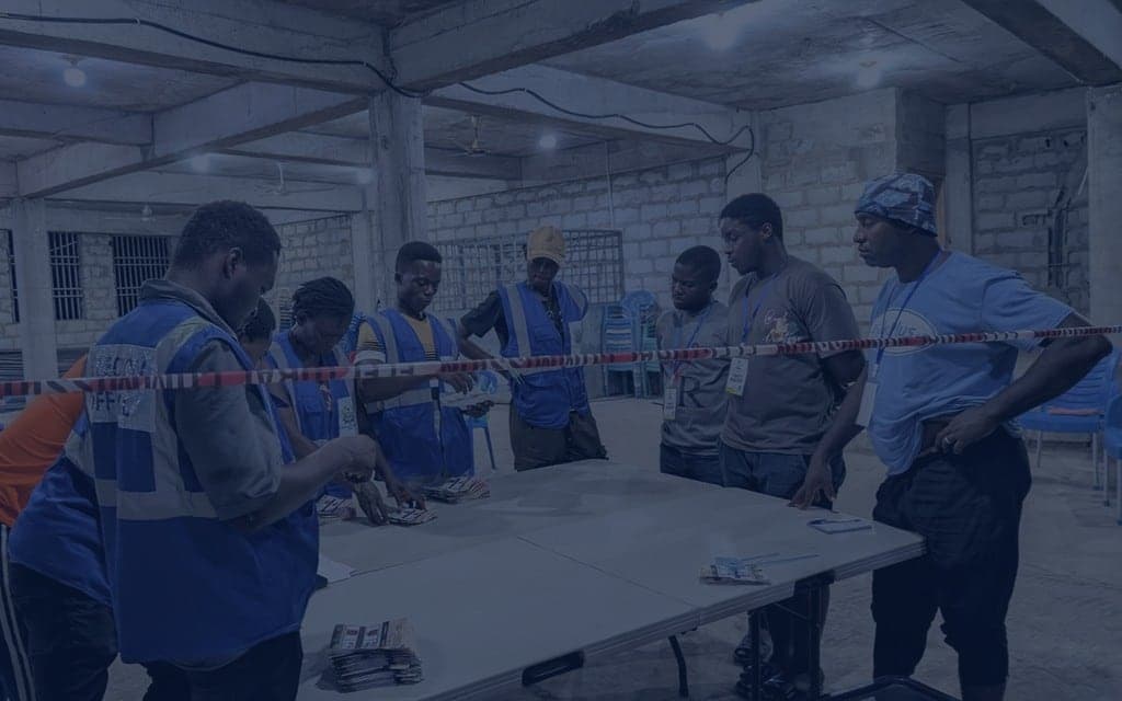 Election officers and polling agents at a polling station
