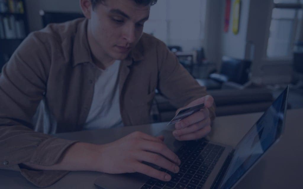 Person typing on laptop at desk