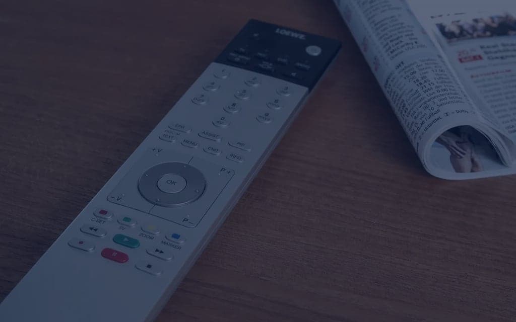 Generic television remote control on white background