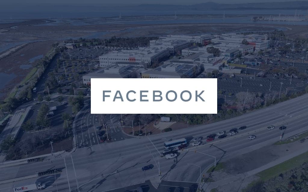Meta logo over a photo of the company