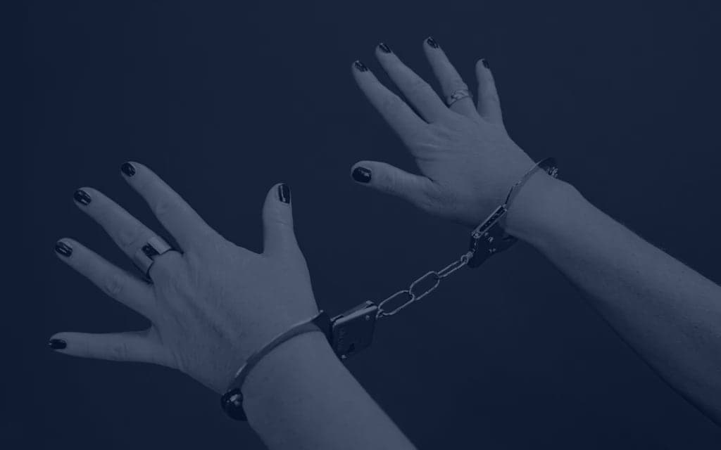 Closeup of hands in handcuffs