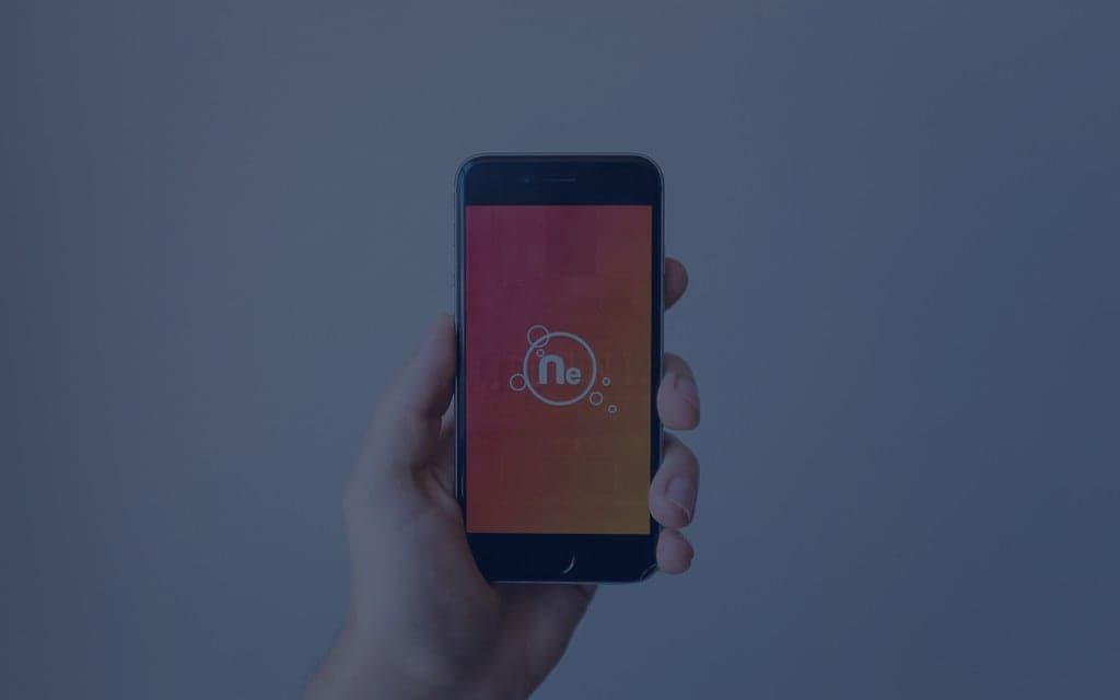 A generic smartphone held in a person's hand