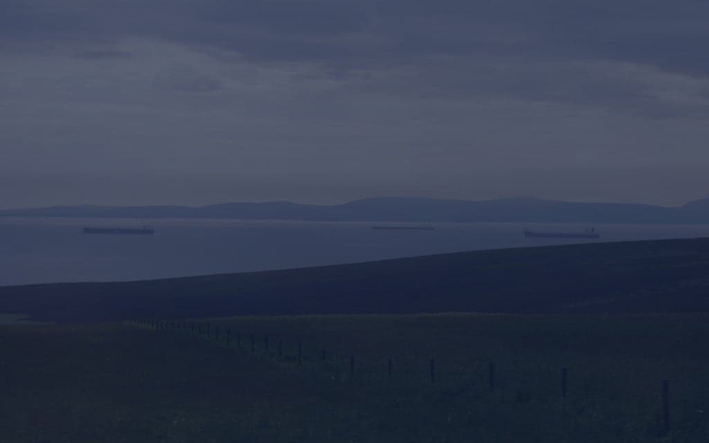 Several large oil tankers anchored in open water