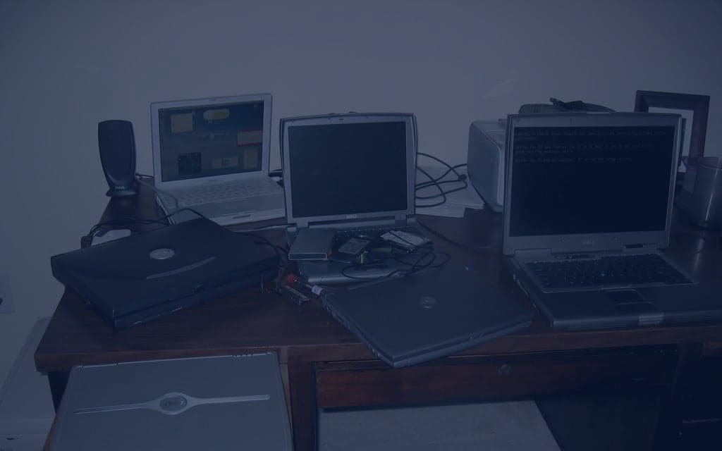Several laptops arranged on a table
